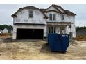 New two-story home with Tyvek wrap, covered entrance, and an attached two-car garage at 151 Retreat Run, Smithfield, NC 27577