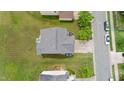 Aerial view of a home, showing the roof, backyard with patio set, and surrounding neighborhood at 2004 Tennessee Rd, Durham, NC 27704