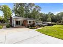 Beautiful single story home with a long driveway and mature trees in a quiet setting at 203 W Boundary St, Cary, NC 27513
