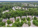 Scenic aerial view of a residential neighborhood with tree-lined streets and well-maintained homes at 205 Slate Blue Pl, Cary, NC 27519