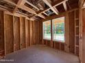 Unfinished bedroom space exhibiting two windows for natural light in new home construction at 209 Atkins Rd, Cameron, NC 28326