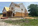 New construction home, framed with brick detailing, shows a home in the process of being built at 209 Atkins Rd, Cameron, NC 28326