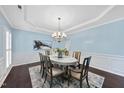 Elegant dining room with modern chandelier and classic wainscoting, great for entertaining guests at 308 Minton Valley Ln, Cary, NC 27519