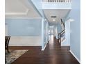 This home has a spacious foyer featuring hardwood floors and a two-story ceiling at 308 Minton Valley Ln, Cary, NC 27519