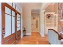 Inviting foyer featuring hardwood floors, natural light, and elegant trim work, leading to living areas at 504 Belmont Cir, Wake Forest, NC 27587