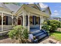 Inviting front porch with charming architectural details and blue painted steps at 517 N East St, Raleigh, NC 27604