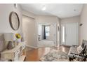 Inviting foyer with hardwood floors, white trim, and a view into the adjacent living spaces at 6512 Blalock Forest Dr, Willow Springs, NC 27592