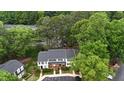 Birds eye view of a well-maintained community with mature trees and manicured lawns at 7719 Kingsberry Ct, Raleigh, NC 27615