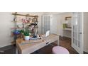 Bright and airy office space with a desk, shelving, and access to the entry at 817 Comice Pear Way, Willow Springs, NC 27592