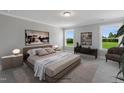 Inviting bedroom with plush carpeting, accent furniture, and serene natural light at 89 Merle Way, Wendell, NC 27591