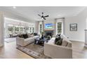 Spacious living room with fireplace, TV, hardwood floors, and plenty of comfortable seating at 1049 Coldspring Circle, Durham, NC 27705
