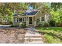 Inviting single-story home with landscaped front yard, classic brick exterior, and welcoming entrance at 1304 N Duke St, Durham, NC 27701