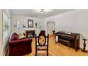 Bright living room with hardwood floors, fireplace, and comfortable seating at 1304 N Duke St, Durham, NC 27701