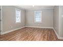 An empty living room featuring luxury vinyl plank flooring and neutral-toned paint at 1416 Betz St, Rocky Mount, NC 27803