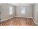 An empty living room featuring luxury vinyl plank flooring and neutral-toned paint at 1416 Betz St, Rocky Mount, NC 27803
