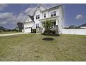 Charming two-story home with well-manicured lawn, a covered porch, and a two car garage at 170 Kinsale Ct, Garner, NC 27529