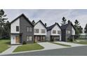 A full street view of townhomes with modern architecture, complemented by lush landscaping and concrete driveways at 1804 Pershing Rd, Raleigh, NC 27608