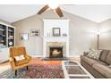 Inviting living room with a fireplace, hardwood floors, and a large decorative rug at 318 Fieldstone Dr, Burlington, NC 27215