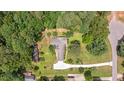 Overhead view of a home with a neatly maintained lawn, landscaping, and a spacious driveway at 8133 Holly Forest Rd, Wake Forest, NC 27587