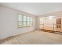 Bright living room with large windows and carpet flooring at 8133 Holly Forest Rd, Wake Forest, NC 27587