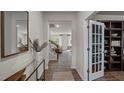 Inviting entryway with hardwood floors that leads into the living spaces with a decorative glass door at 818 Comice Pear Way, Willow Springs, NC 27592
