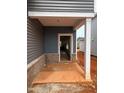 Home entryway with blue siding and white trim at 829 Ottawa Dr, Garner, NC 27529