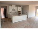 Bright kitchen with white cabinets and island at 829 Ottawa Dr, Garner, NC 27529