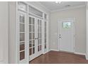 Office or den showcases beautiful french doors and hardwood flooring at 1112 Monterey Bay Dr, Wake Forest, NC 27587