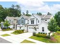View of the house showing the lawn and garage with landscaping and nice walkways at 1240 Gemfor St, Durham, NC 27703