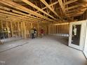 Spacious living room under construction shows the framing and structure before the walls are up at 136 Tuskeegee Dr, Smithfield, NC 27577