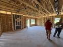 Spacious living room under construction shows the framing and structure before the walls are up at 136 Tuskeegee Dr, Smithfield, NC 27577