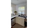Well-lit kitchen featuring updated countertops, sleek appliances, and a modern sink at 200 S Pettigrew St, Raleigh, NC 27610