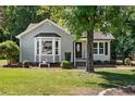 Cozy home featuring a bay window and inviting front yard landscaping at 2213 Stephanie Ln, Clayton, NC 27520