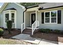 Inviting front entrance with brick steps and decorative door at 2213 Stephanie Ln, Clayton, NC 27520