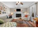 Cozy living room features a fireplace, plush seating, and stylish decor for a comfortable and inviting atmosphere at 3541 E Jameson Rd, Raleigh, NC 27604