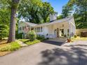 Inviting exterior with a brick facade, well-manicured lawn, and a covered carport for convenient parking at 4112 Rowan St, Raleigh, NC 27609