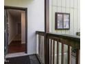 Exterior entry featuring a rustic wood porch and front door open to the home's interior at 514 Pine Ridge Pl, Raleigh, NC 27609