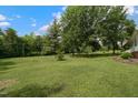 Expansive green yard with mature trees, offering a serene and private outdoor space at 578 Jeffries Cross Rd, Burlington, NC 27217