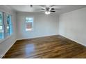 Spacious bedroom with hardwood floors and natural light streaming through a window at 600 Cecil St, Durham, NC 27707