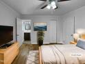 Relaxing bedroom with neutral tones, hardwood floors, and an ensuite bathroom at 600 Cecil St, Durham, NC 27707