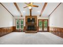Spacious living room with vaulted ceilings, fireplace, and hardwood accents at 8509 Ashwood Dr, Raleigh, NC 27603