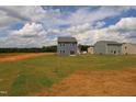Large backyard showcasing well-maintained lawn and ample space for recreation and relaxation at 970 Bombardier Aly, Spring Hope, NC 27882