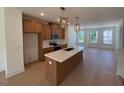 Gourmet kitchen features an island, modern appliances, and stylish pendant lighting at 1002 Regalia Rd # 2, Durham, NC 27713