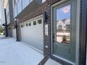 Exterior front entry view of garage and front door at 1004 Regalia Rd # 3, Durham, NC 27713