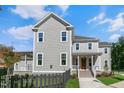 Beautiful two-story home featuring classic architecture and a quaint front porch at 1029 Whitehall Cir, Durham, NC 27713