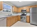 Functional kitchen with stainless steel appliances, bright countertops, and ample cabinet space at 105 Walehurst Ridge Dr, Angier, NC 27501