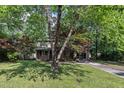 The lawn and shade trees surrounding the house provides cool shade in the summer at 1115 Chestnut Dr, Smithfield, NC 27577