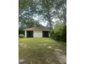 Spacious detached two-car garage, perfect for parking and storage, set in a lush green yard at 112 E Sycamore St, Zebulon, NC 27597