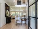 Elegant foyer featuring a staircase, hardwood floors, and stylish furnishings, creating a welcoming entrance at 115 Founders Ridge Dr, Chapel Hill, NC 27517