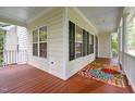 Spacious front porch featuring a colorful rug and ample natural light at 118 Cavendish Ct, Hillsborough, NC 27278